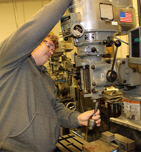 Student working on machine